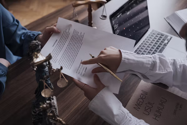 Legal consultant reviewing compliance documents